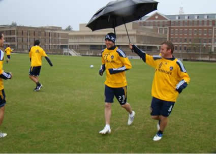 Chris Birchall Holds Umbrella for Beckham