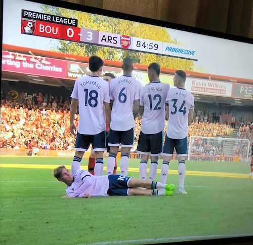 Smith Rowe Lying Down Behind Wall